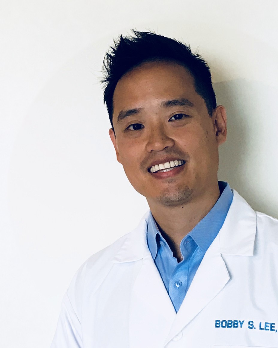 Dr. Bobby S. Lee in his white lab coat